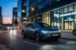 Toyota bZ7 flagship electric sedan front view with light bar and roof lidar